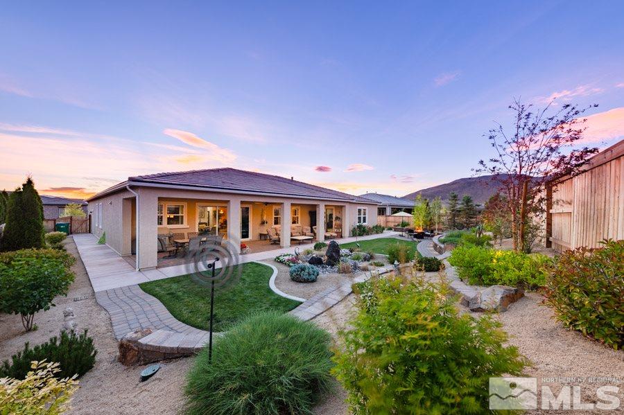9850 Firefoot Lane Reno, NV 89521 - Photo 36 of 40 a front view of a house with garden