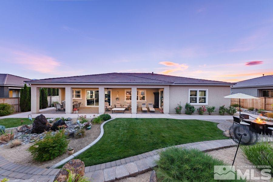9850 Firefoot Lane Reno, NV 89521 - Photo 37 of 40 a front view of a house with a garden and patio