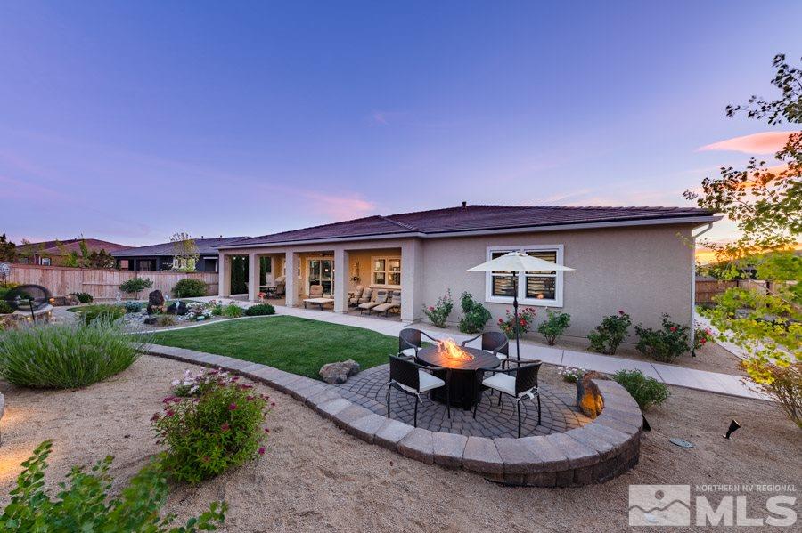 9850 Firefoot Lane Reno, NV 89521 - Photo 38 of 40 a view of a house with backyard sitting area and garden