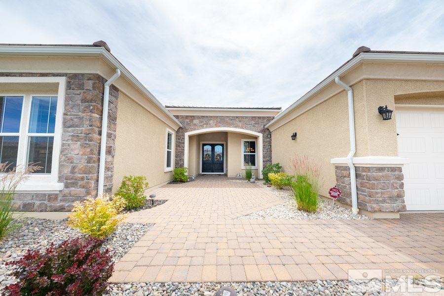 9850 Firefoot Lane Reno, NV 89521 - Photo 4 of 40 a front view of a house with garden