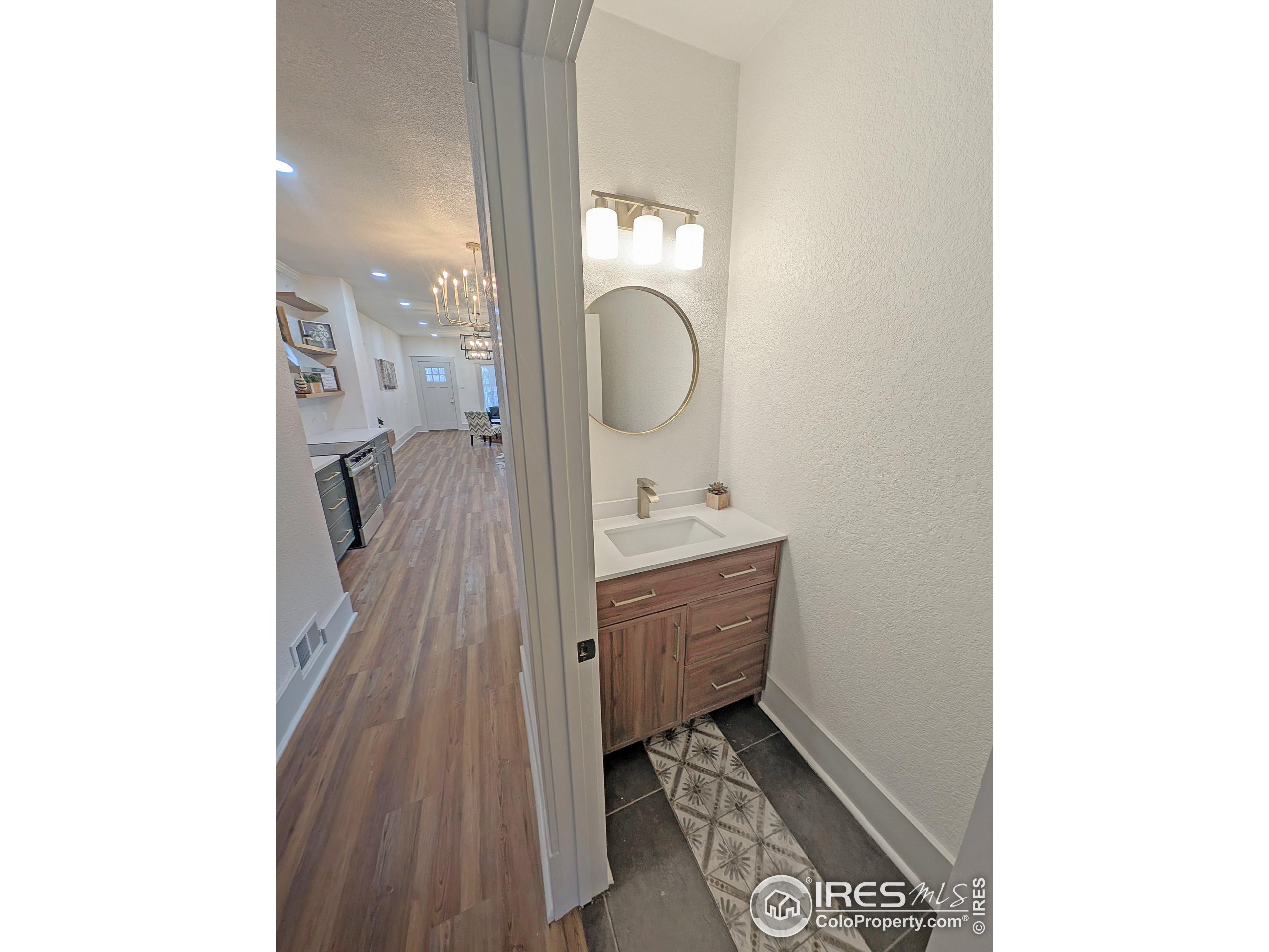 710 Carson Street Brush, CO 80723 - Photo 18 of 31 a bathroom with a sink and a mirror
