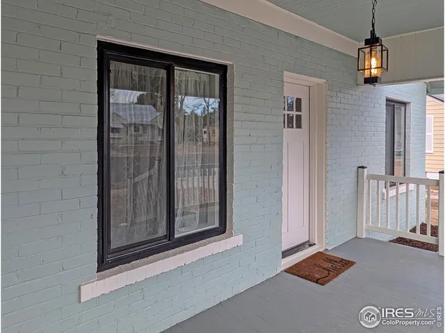 a view of a yard with large trees