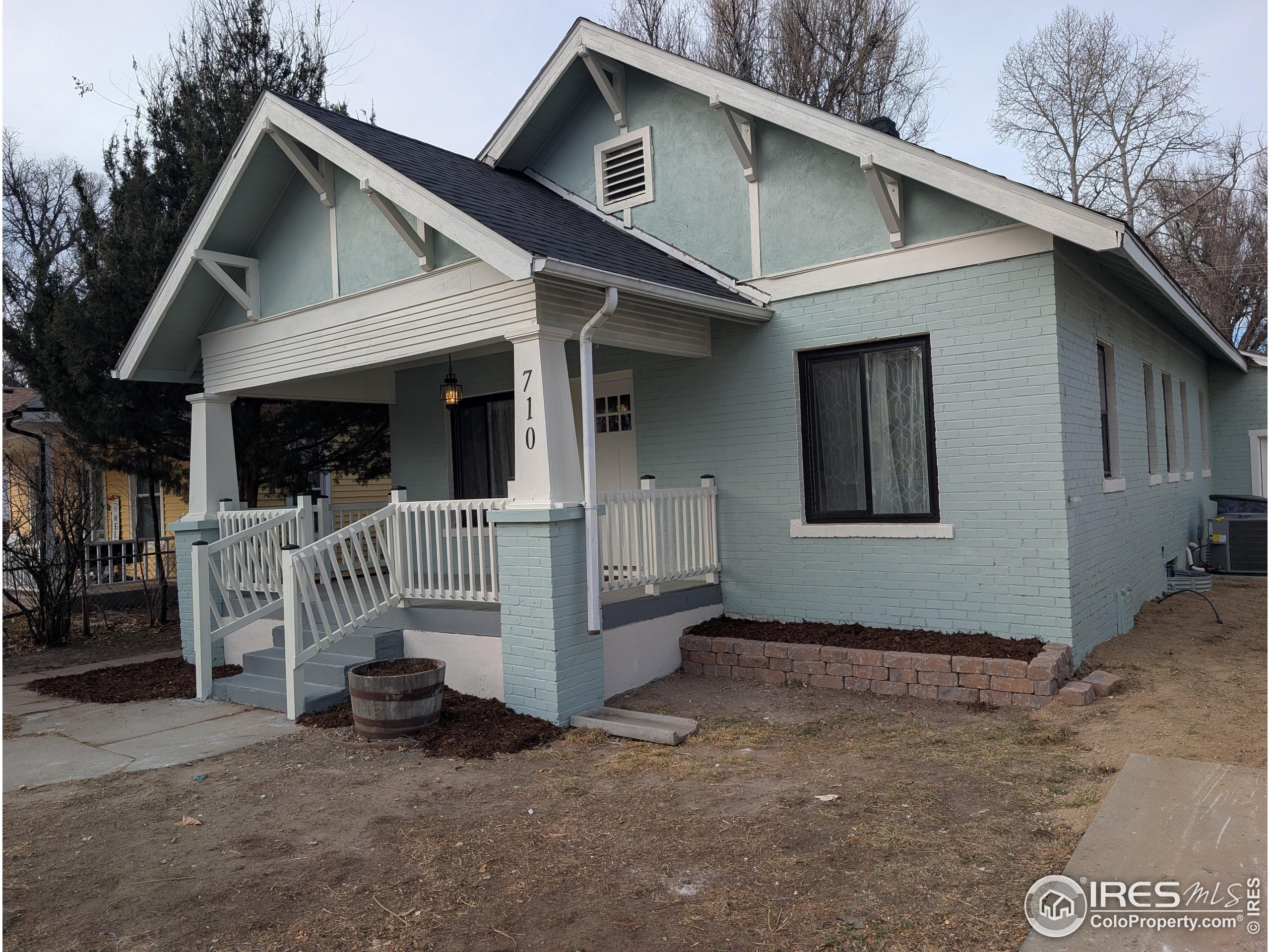 710 Carson Street Brush, CO 80723 - Photo 27 of 31 a view of a house with a small yard and wooden fence