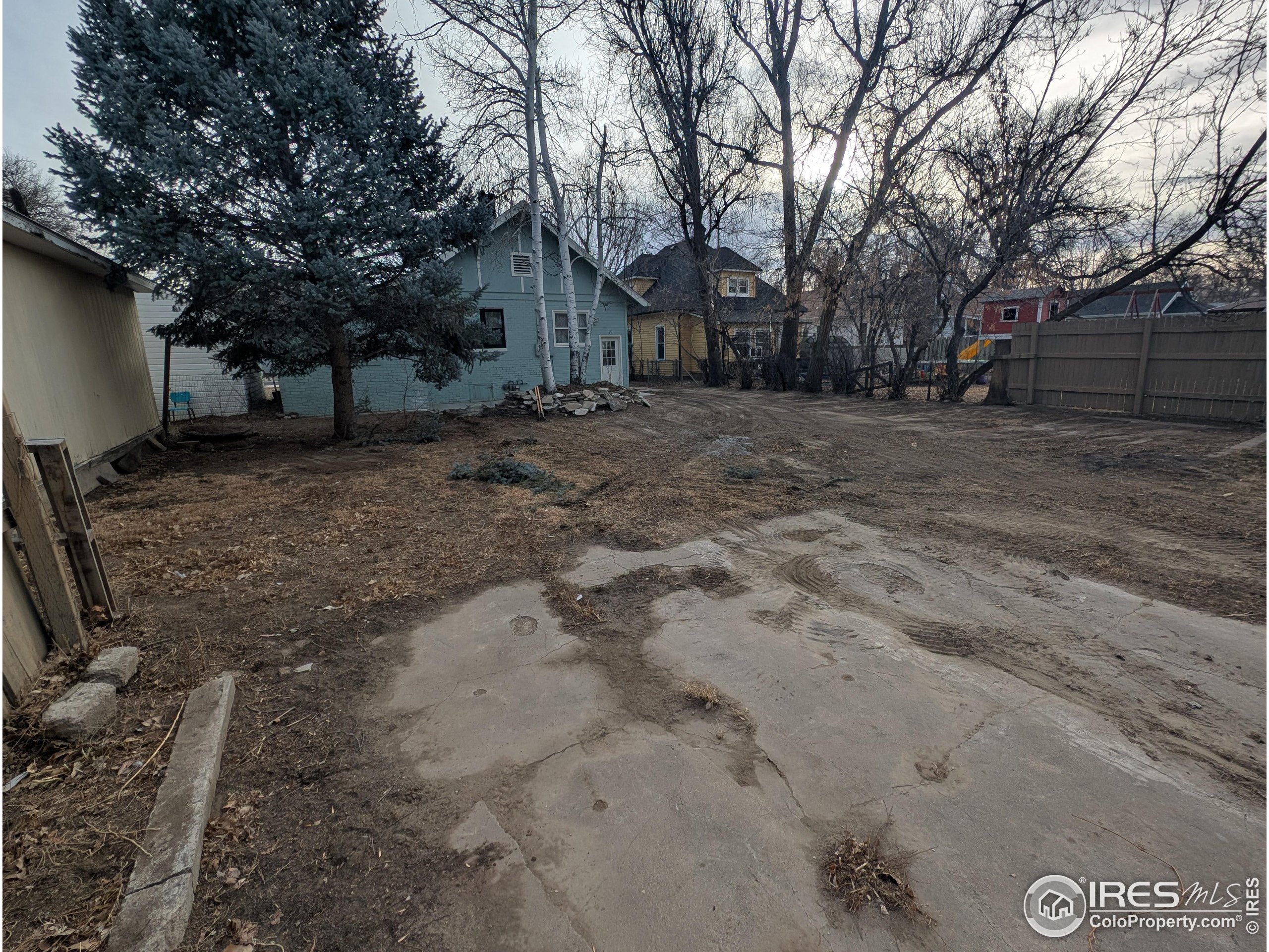 710 Carson Street Brush, CO 80723 - Photo 31 of 31 a view of a yard with large trees