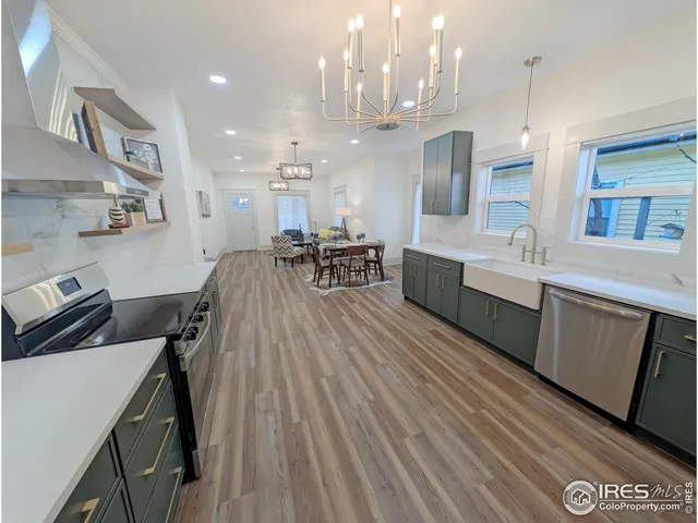 a living room with lots of furniture and a wooden floor