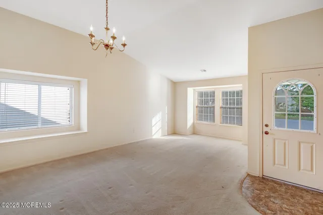 a view of a kitchen with a sink and a window