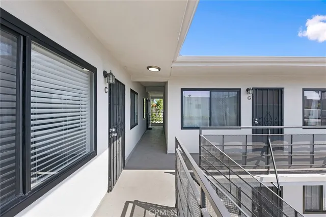 a view of a living room and entryway