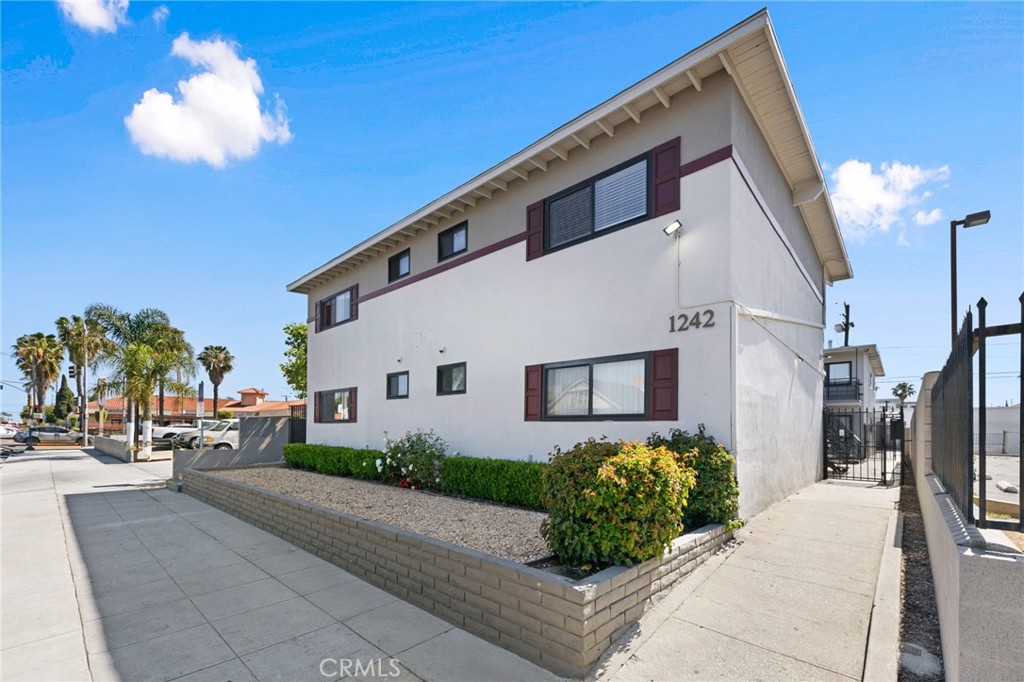 1242 Cedar Avenue Long Beach, CA 90813 - Photo 2 of 22 a front view of a house with a yard