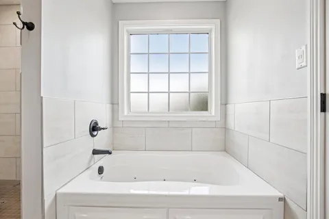 a bathroom with a glass shower door