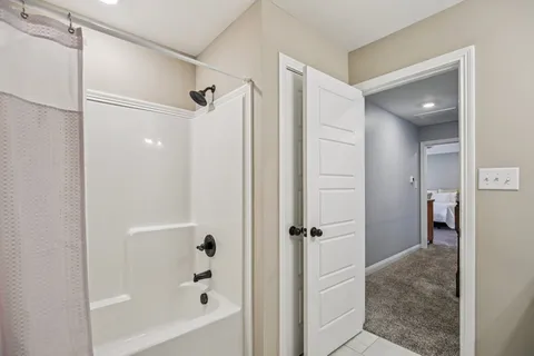 a view of a workspace with furniture and a chandelier fan