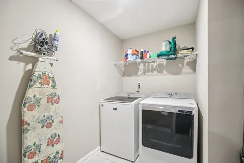 a balcony with furniture and a ceiling fan