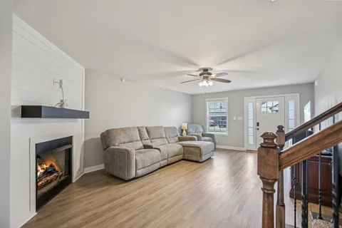a living room with furniture and a fireplace