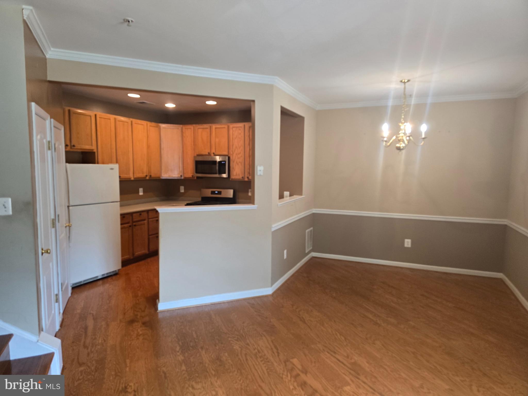 102 Royal Bonnet Place Frederick, MD 21702 - Photo 2 of 23 a kitchen with granite countertop a sink cabinets and stainless steel appliances