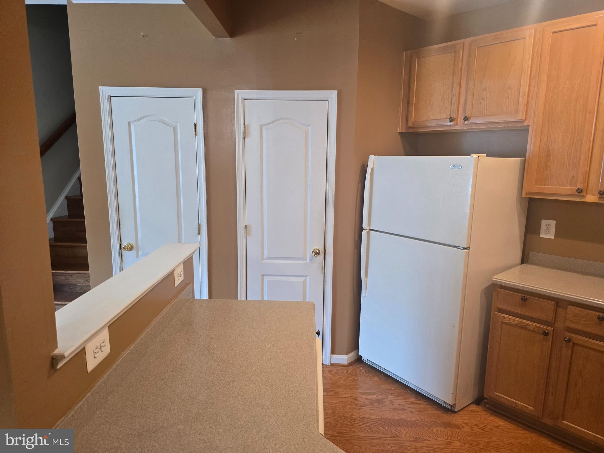 102 Royal Bonnet Place Frederick, MD 21702 - Photo 4 of 23 a view of a kitchen with refrigerator and cabinet