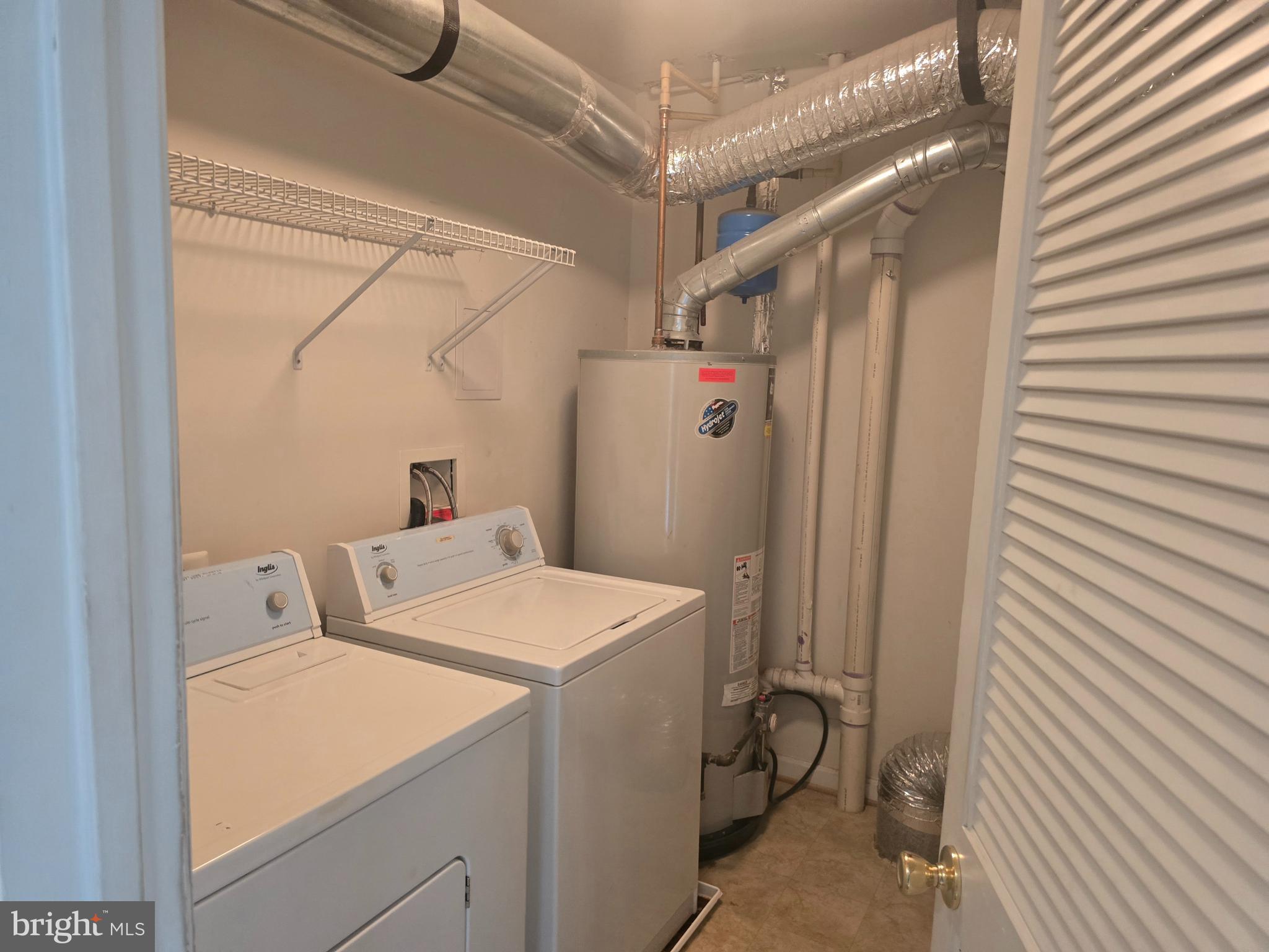 102 Royal Bonnet Place Frederick, MD 21702 - Photo 8 of 23 a utility room with dryer and washer