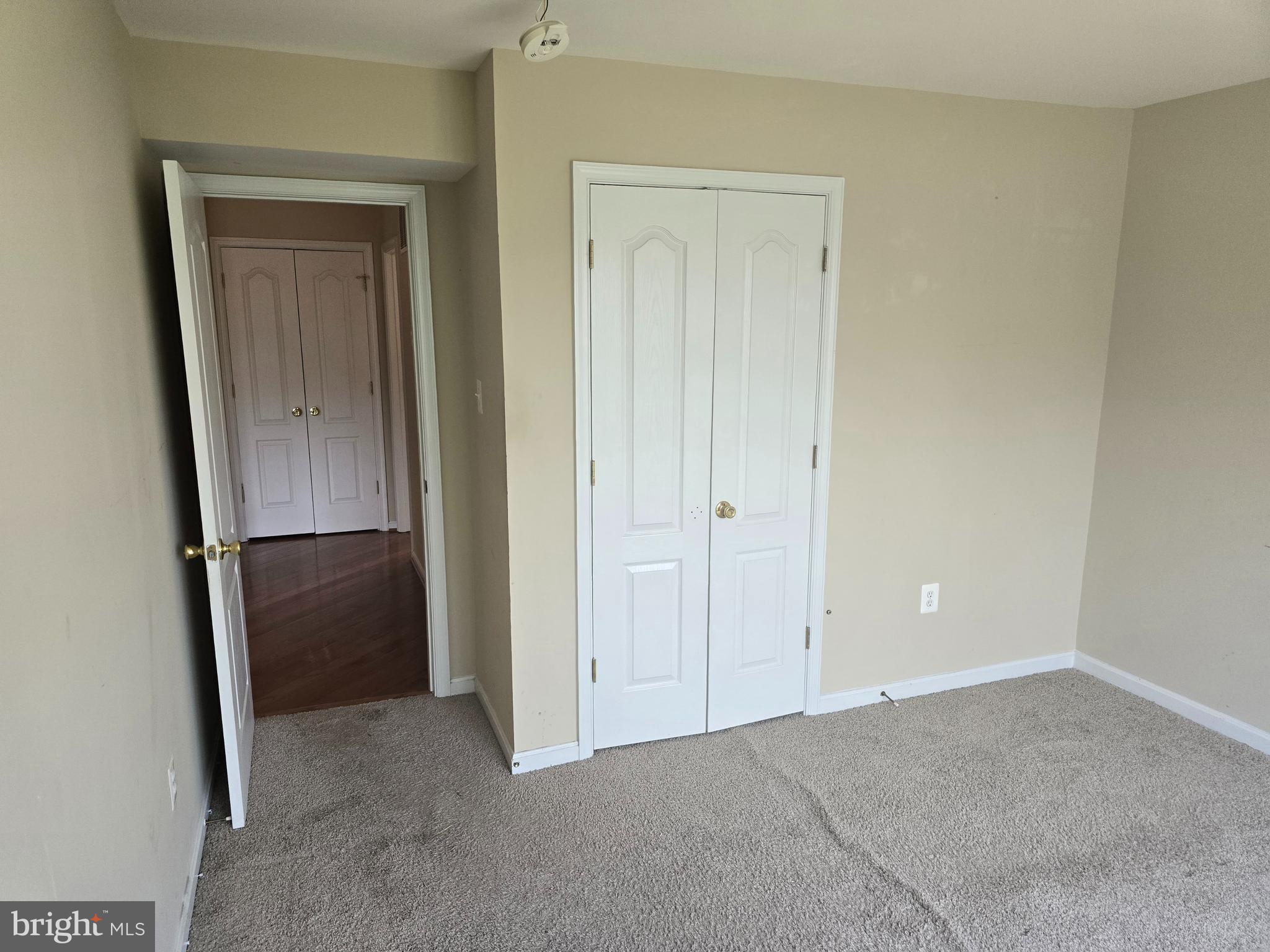 102 Royal Bonnet Place Frederick, MD 21702 - Photo 10 of 23 an empty room with closet and door