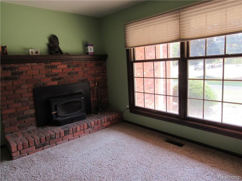 23801 Irwin Road Armada, MI 48005 - Photo 24 of 36 DEN WITH WOOD BURNER FIREPLACE