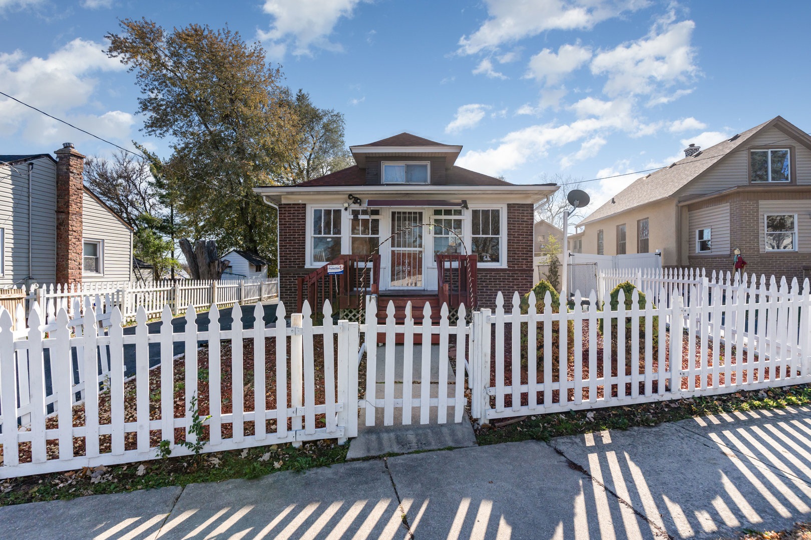 1311 Kane Street Aurora, IL 60505 - Photo 1 of 13 a front view of a house with a garden
