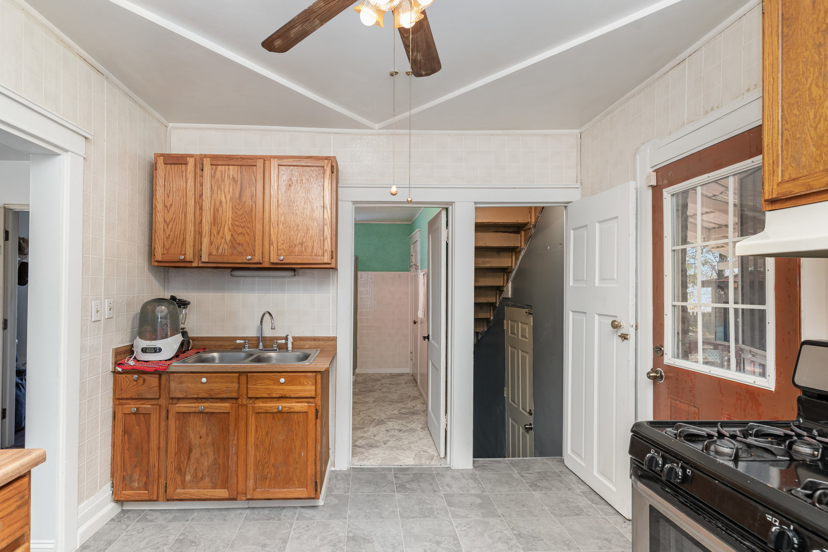 1311 Kane Street Aurora, IL 60505 - Photo 6 of 13 a kitchen with stainless steel appliances granite countertop a stove and a refrigerator