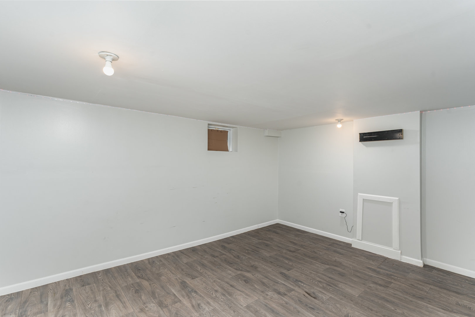 1311 Kane Street Aurora, IL 60505 - Photo 10 of 13 a view of an empty room with wooden floor