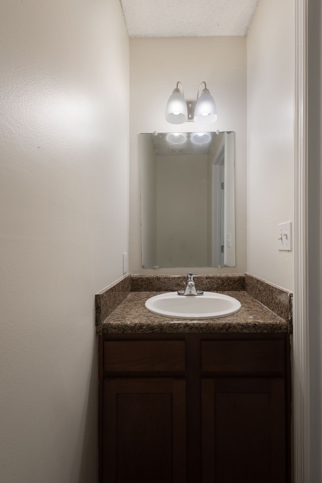 616 Castlegate Drive Nashville, TN 37217 - Photo 14 of 19 a bathroom with a granite countertop sink and a mirror