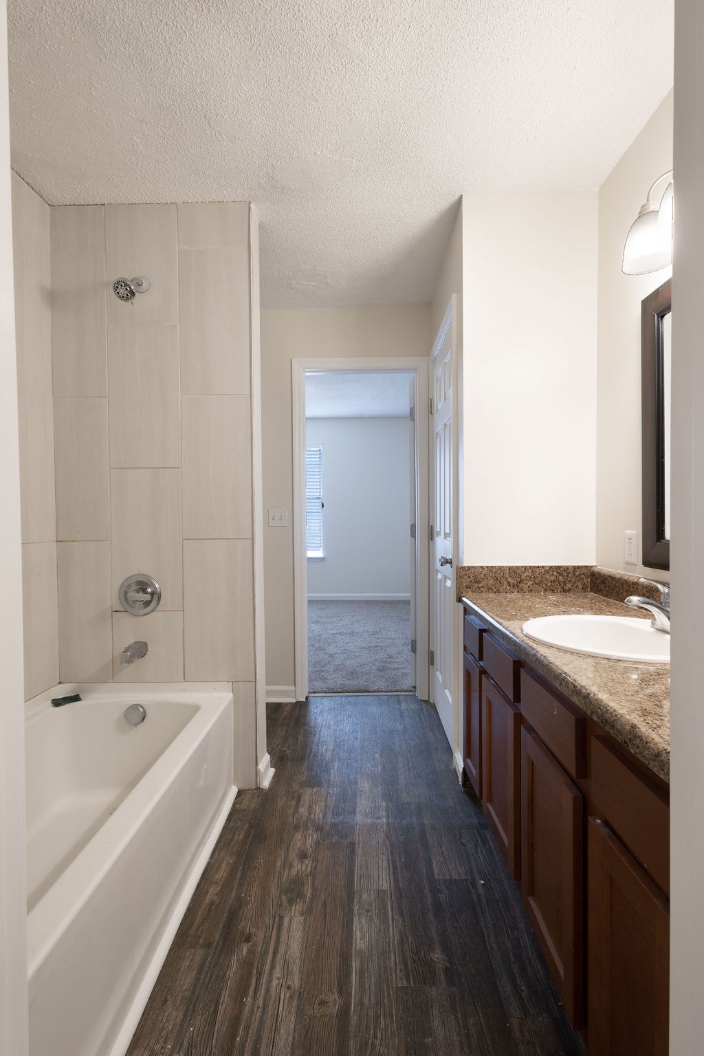 616 Castlegate Drive Nashville, TN 37217 - Photo 16 of 19 a bathroom with a tub sink and mirror