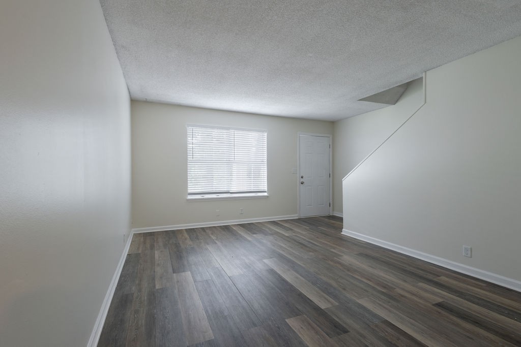 616 Castlegate Drive Nashville, TN 37217 - Photo 5 of 19 an empty room with wooden floor and windows