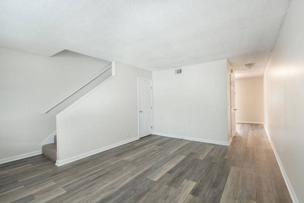 616 Castlegate Drive Nashville, TN 37217 - Photo 7 of 19 a view of an empty room with wooden floor