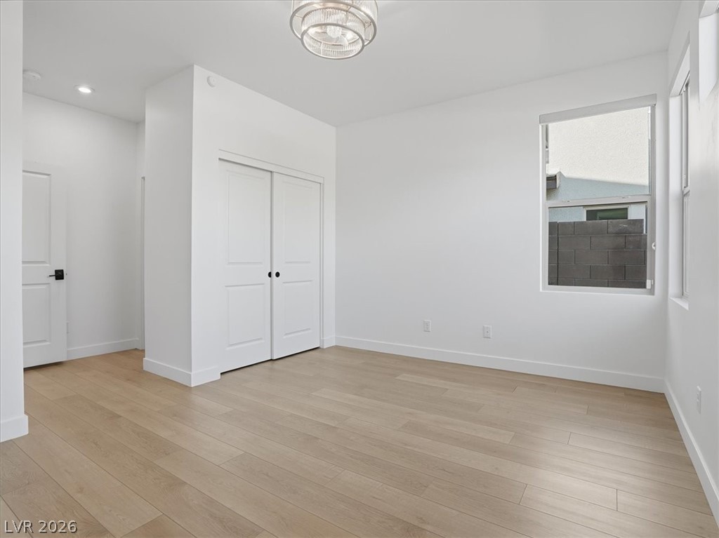 9725 Starlight Ridge Avenue Las Vegas, NV 89148 - Photo 22 of 47 This bright room features beautiful flooring and a functional closet, perfect for comfortable living.