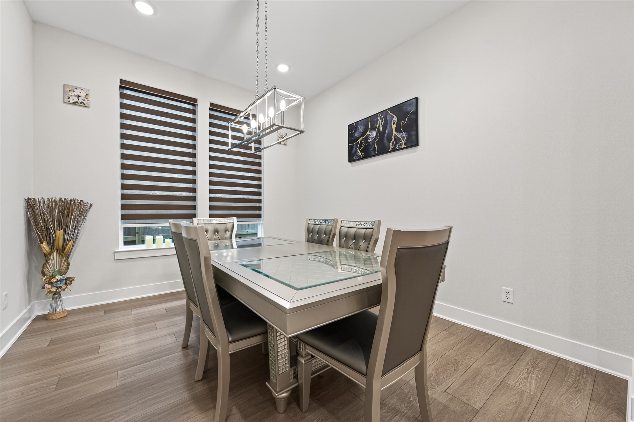 147 Nightshade Street Richmond, TX 77406 - Photo 20 of 47 Elegant formal dining area featuring beautiful lighting, creating a sophisticated space perfect for entertaining and special occasions.
