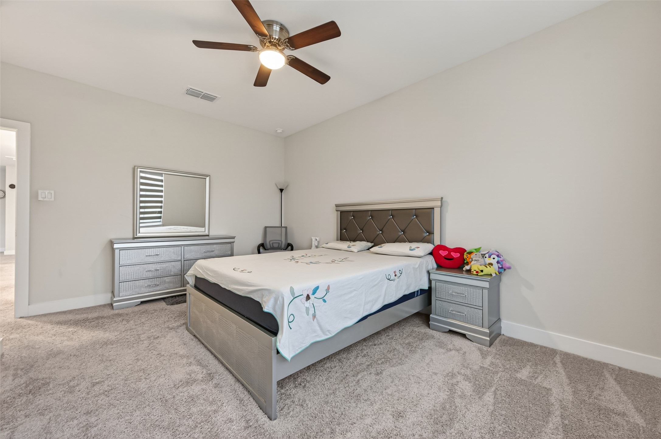 147 Nightshade Street Richmond, TX 77406 - Photo 32 of 47 Secondary bedroom # 3 on the second floor featuring a generous layout and a large walk-in closet, perfect for comfort and storage