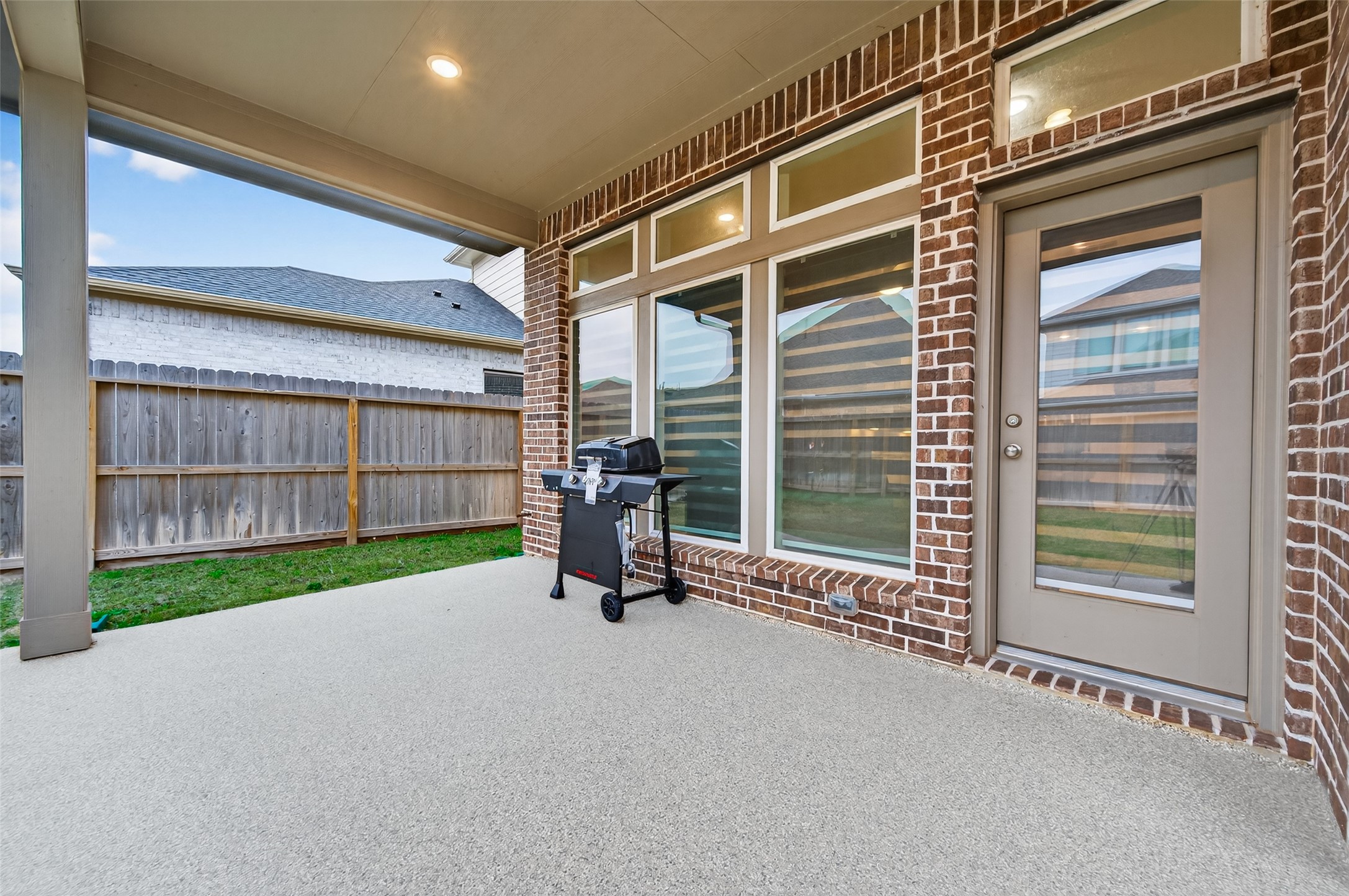 147 Nightshade Street Richmond, TX 77406 - Photo 39 of 47 Exceptional outdoor living awaits on this covered patio, upgraded with durable epoxy flooring and a gas stub for effortless grilling and entertaining. A true low-maintenance sanctuary for year-round fun