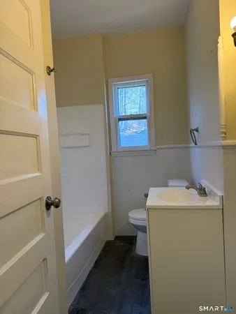 a bathroom with a sink toilet and tub