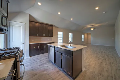 a kitchen with a stove and a sink