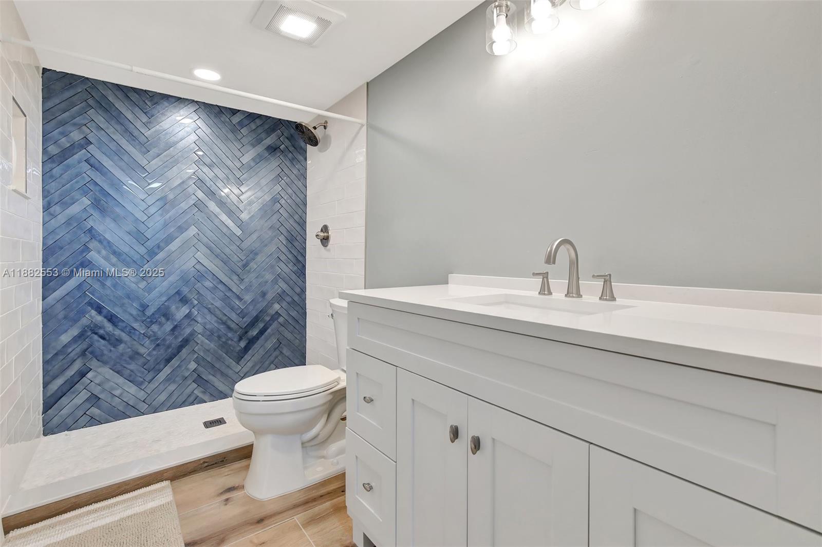 520 Orton Avenue, Unit 303 Fort Lauderdale, FL 33304 - Photo 14 of 20 a bathroom with a sink a toilet and shower