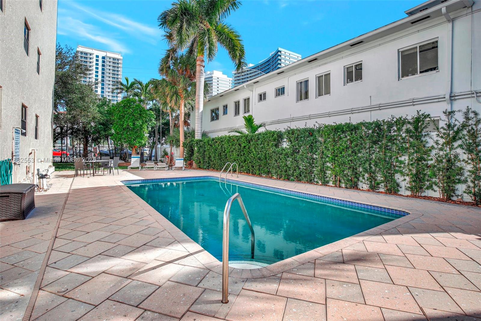 520 Orton Avenue, Unit 303 Fort Lauderdale, FL 33304 - Photo 19 of 20 a view of a swimming pool with a patio