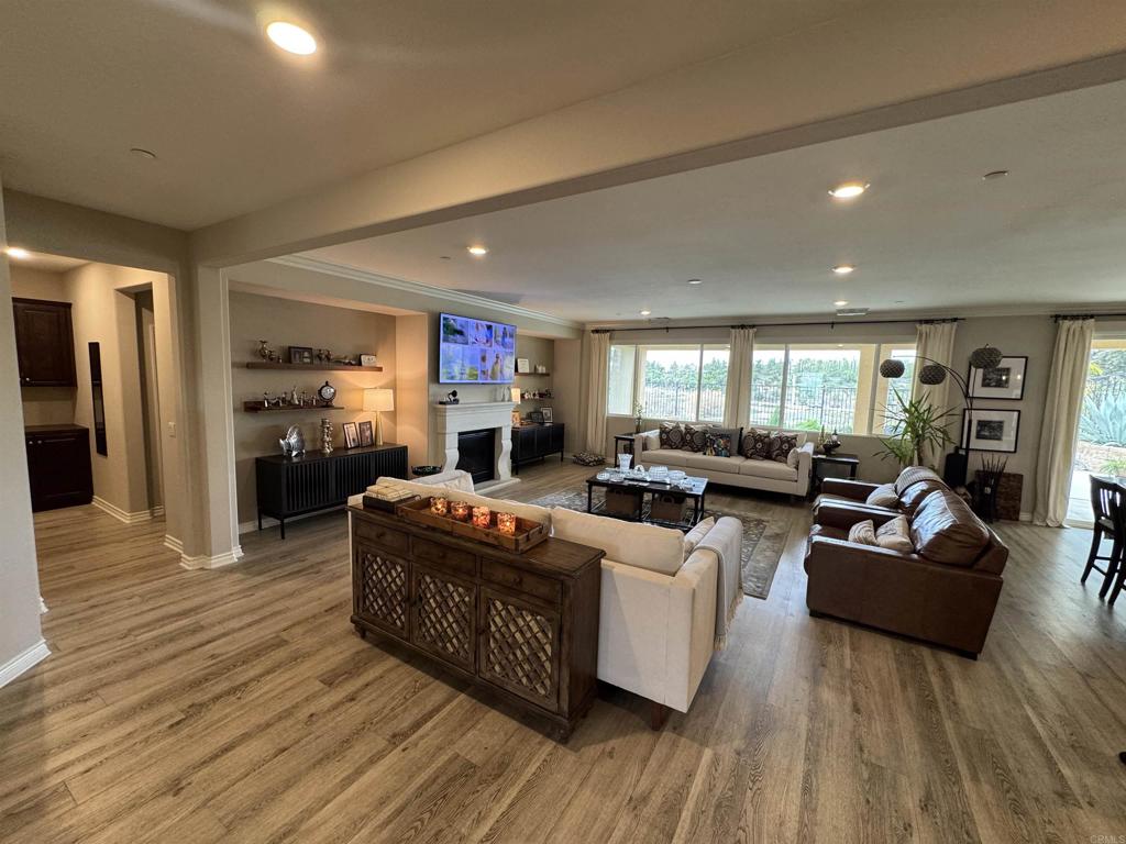 33792 Baystone Street Temecula, CA 92592 - Photo 12 of 21 a living room with furniture windows and a fireplace