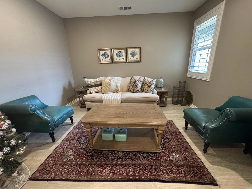 33792 Baystone Street Temecula, CA 92592 - Photo 13 of 21 a living room with furniture and a rug