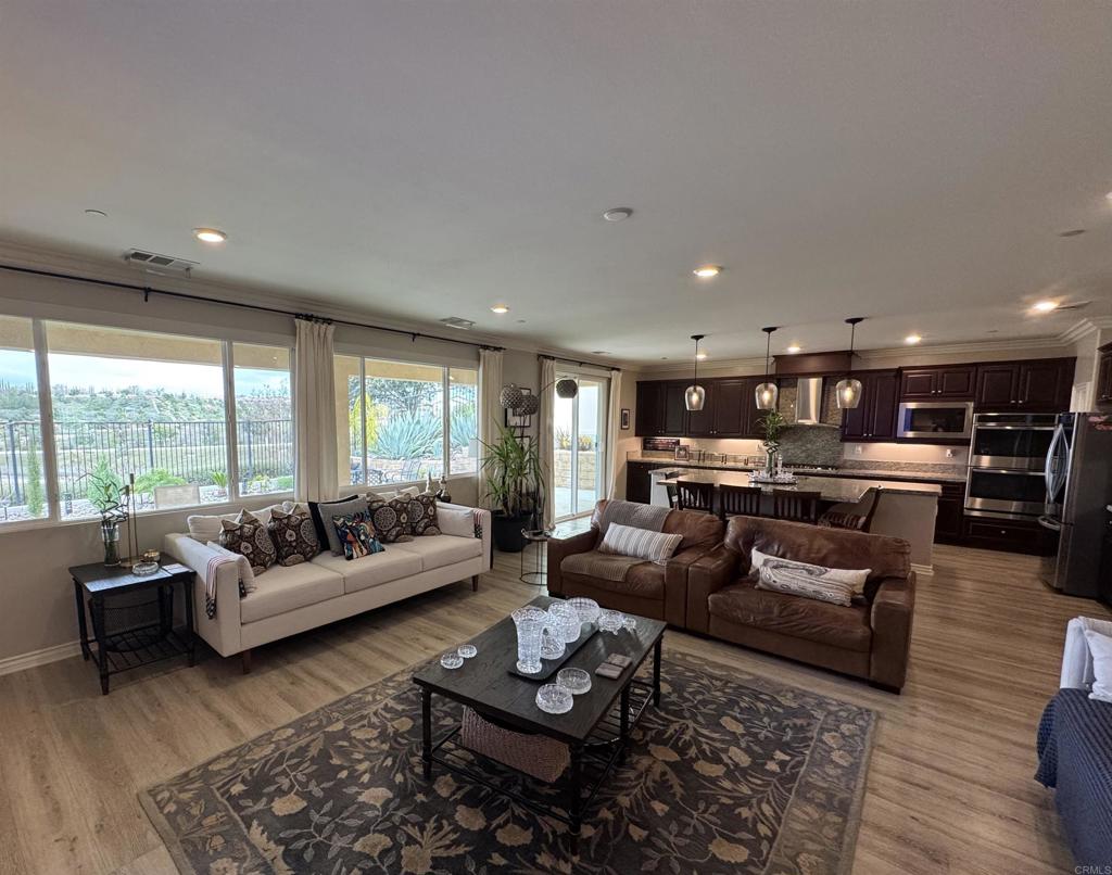 33792 Baystone Street Temecula, CA 92592 - Photo 14 of 21 a living room with furniture and a large window