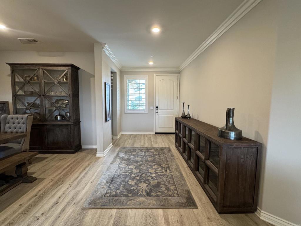 33792 Baystone Street Temecula, CA 92592 - Photo 16 of 21 a view of hallway with wooden floor