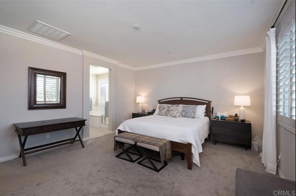 33792 Baystone Street Temecula, CA 92592 - Photo 19 of 21 a bedroom with a bed and a lamp on desk