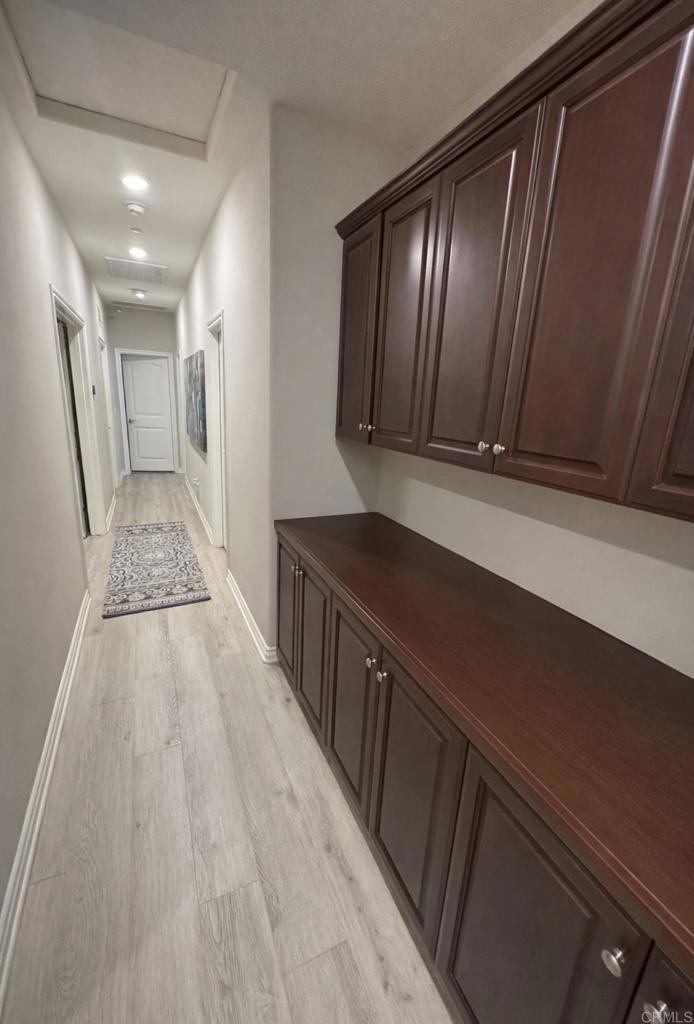 33792 Baystone Street Temecula, CA 92592 - Photo 21 of 21 a view of a hallway with wooden floor