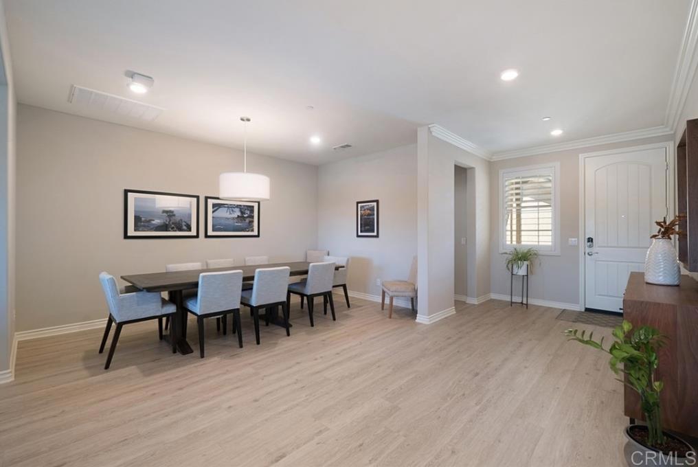 33792 Baystone Street Temecula, CA 92592 - Photo 10 of 21 a view of a dining room with furniture and wooden floor