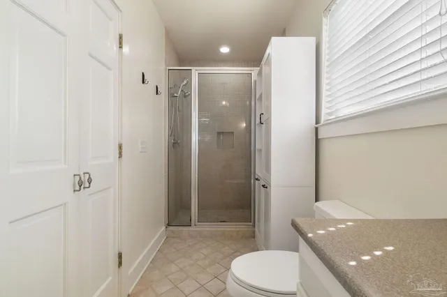a view of a house with backyard and a tree