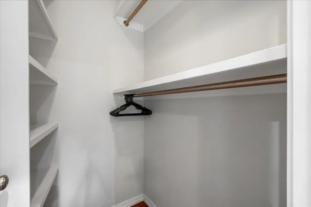 a kitchen with stainless steel appliances a stove a sink and a refrigerator