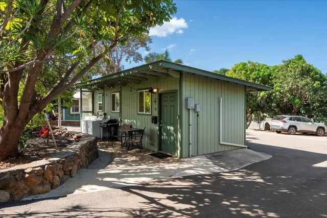 a bedroom with a large bed and a large window