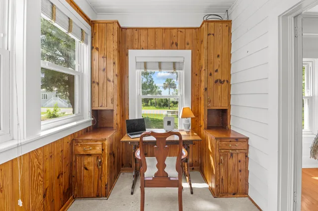 a view of a porch with a floor to ceiling window