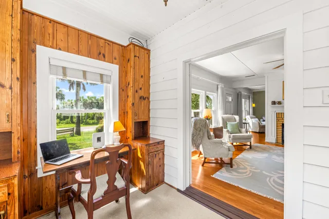a view of hallway with wooden floor