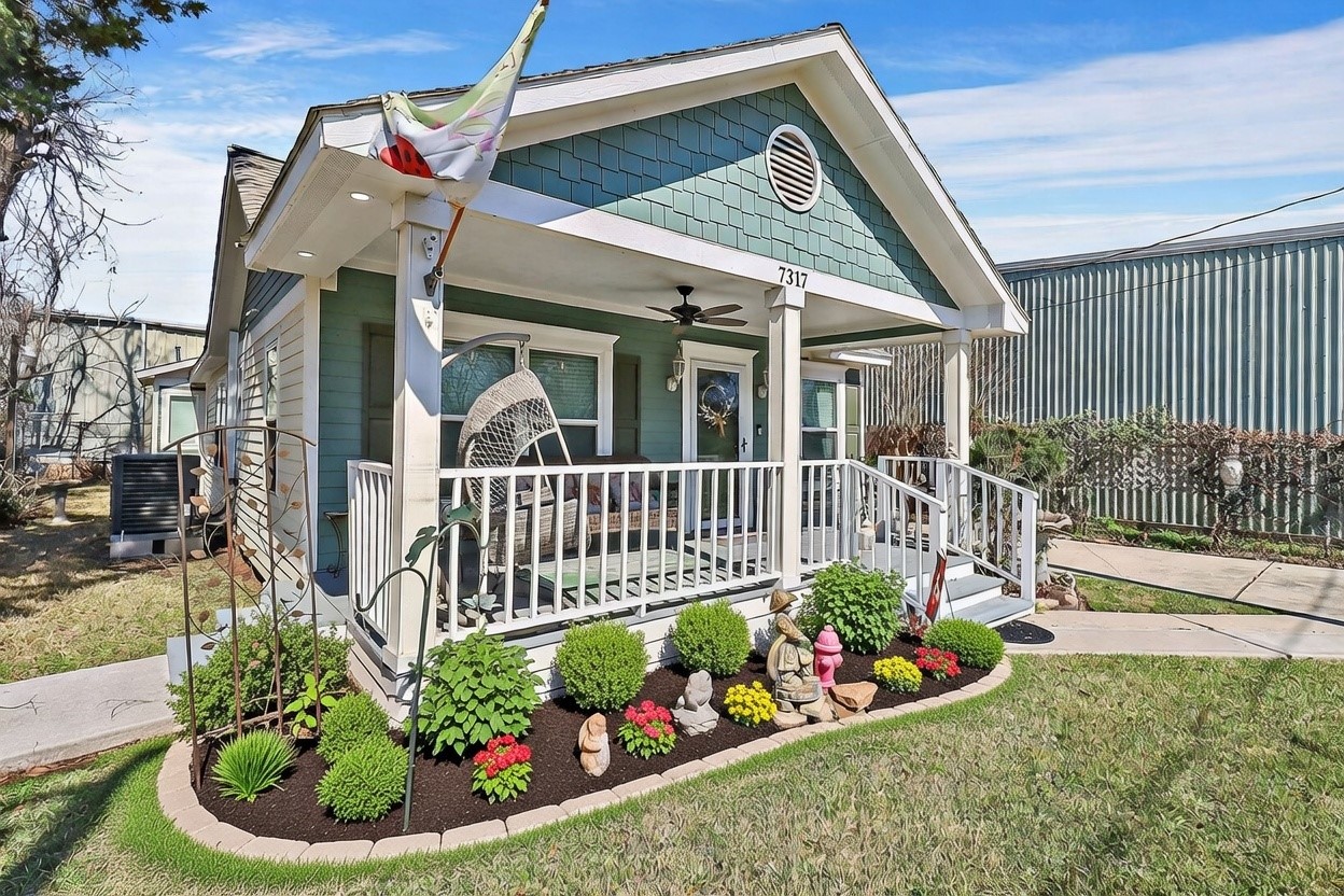 a view of a porch with a garden
