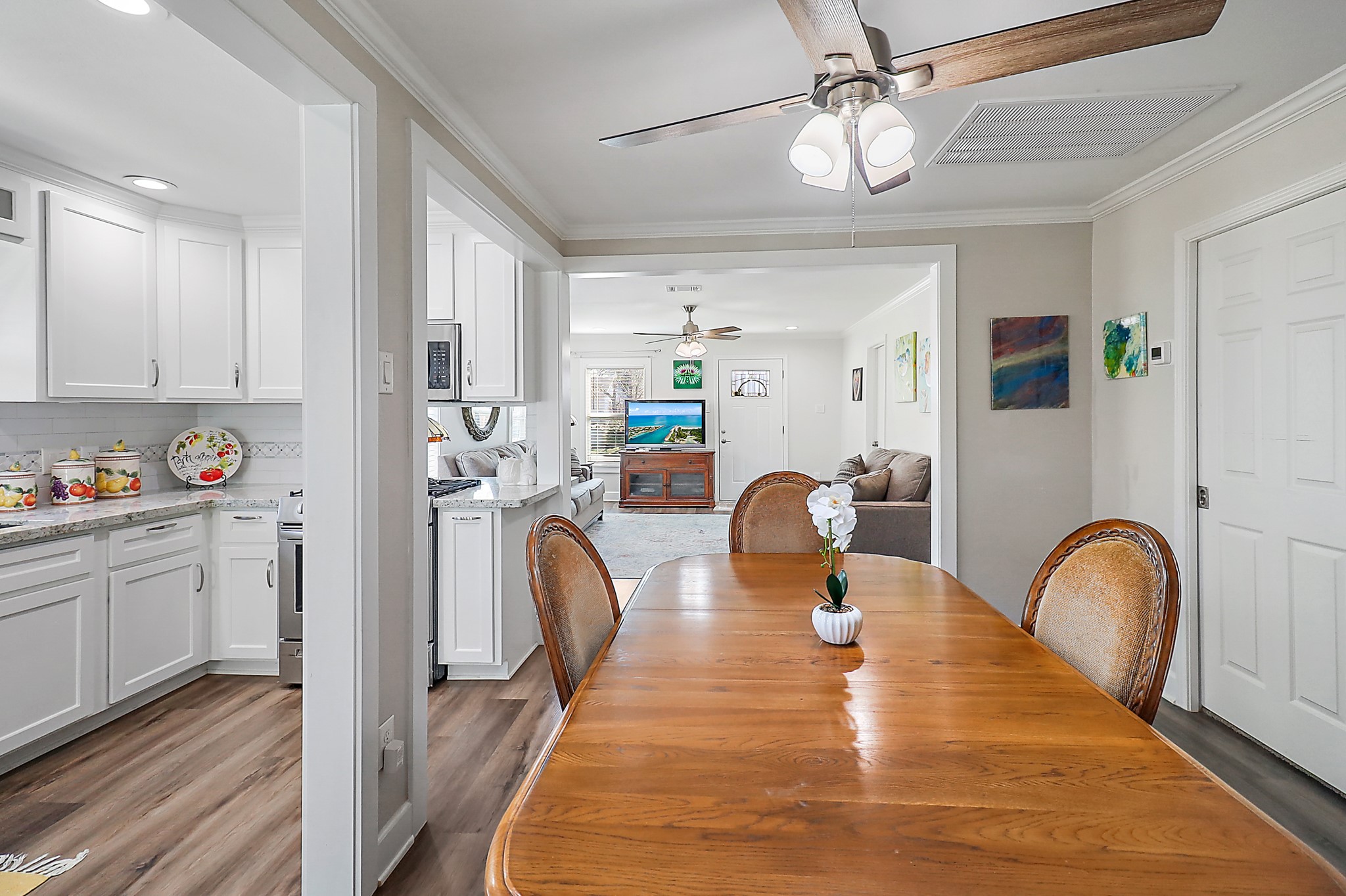 7317 Longview Street Houston, TX 77020 - Photo 13 of 30 a dining room with stainless steel appliances granite countertop couches chairs and couches with wooden floor